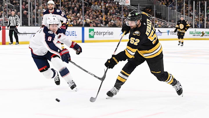 Feb 26, 2026; Boston, Massachusetts, USA; Boston Bruins center Sean Kuraly (52) scores a goal against Columbus Blue Jackets defenseman Zach Werenski (8) during the third period at TD Garden. Mandatory Credit: Eric Canha-Imagn Images