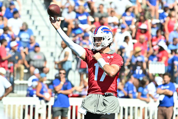 Buffalo Bills quarterback Josh Allen throws a pass during training camp at St. John Fisher University. Buffalo Bills quarterback Josh Allen throws a pass during training camp at St. John Fisher University.