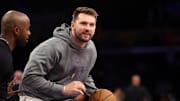 Mar 31, 2025; Los Angeles, California, USA;  Los Angeles Lakers guard Luka Doncic (77) warms up before the game against the Houston Rockets at Crypto.com Arena. Mandatory Credit: Kiyoshi Mio-Imagn Images