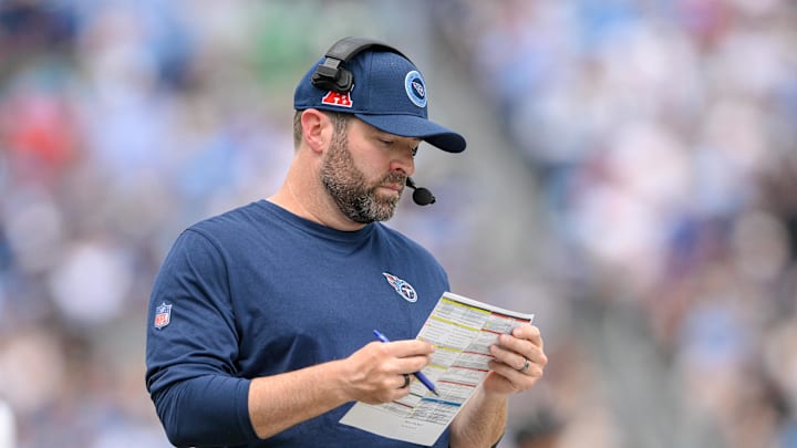 Sep 15, 2024; Nashville, Tennessee, USA; Tennessee Titans head coach Brian Callahan looks at his play sheet against the New York Jets during the first half at Nissan Stadium. Mandatory Credit: Steve Roberts-Imagn Images Sep 15, 2024; Nashville, Tennessee, USA; Tennessee Titans head coach Brian Callahan looks at his play sheet against the New York Jets during the first half at Nissan Stadium. Mandatory Credit: Steve Roberts-Imagn Images