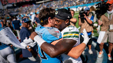 Tennessee Titans linebacker Jack Gibbens (50) greets Green Bay Packers quarterback Malik Willis (2) after the packers won 30-14 at Nissan Stadium in Nashville, Tenn., Sunday, Sept. 22, 2024.