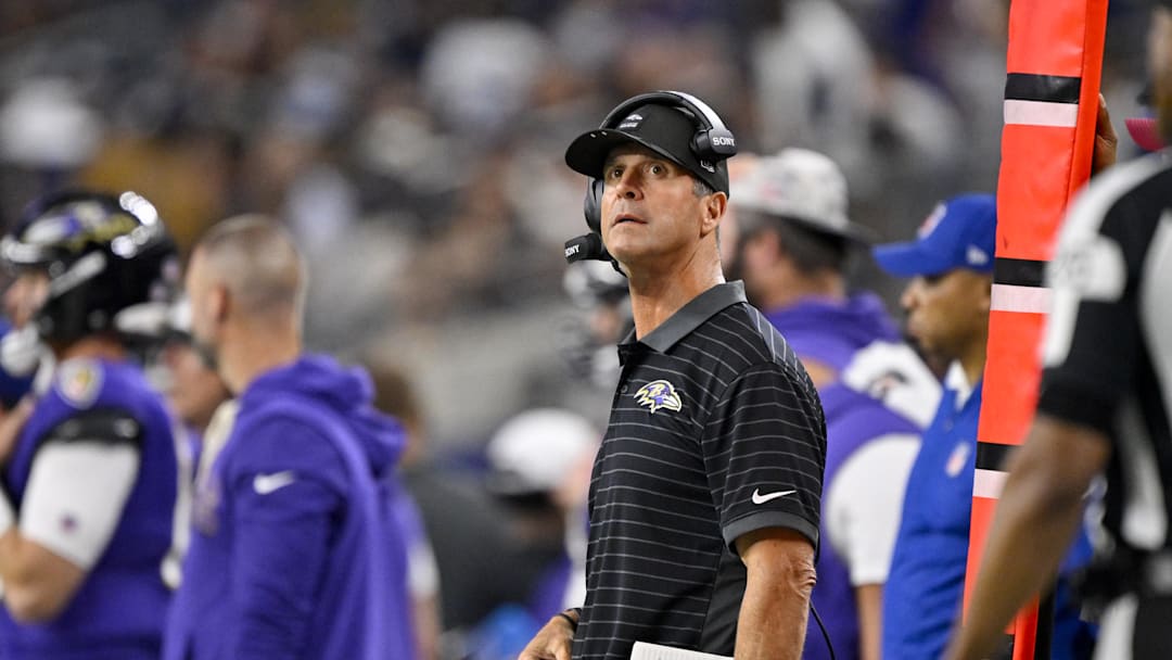 Aug 16, 2025; Arlington, Texas, USA; Baltimore Ravens head coach John Harbaugh looks on during the second half against the Dallas Cowboys at AT&T Stadium. Mandatory Credit: Jerome Miron-Imagn Images