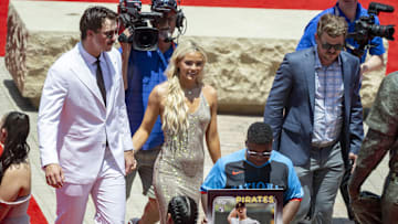 Jul 16, 2024; Arlington, Texas, USA; National League pitcher Paul Skenes of the Pittsburgh Pirates walks the red carpet with his girlfriend LSU gymnast Olivia Livvy Dunne before the 2024 MLB All-Star game at Globe Life Field. 