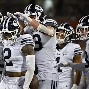 Sep 6, 2024; Dallas, Texas, USA; Brigham Young Cougars cornerback Marque Collins (2) celebrates with his teammates after he intercepts a pass during the second half against the Southern Methodist Mustangs at Gerald J. Ford Stadium.