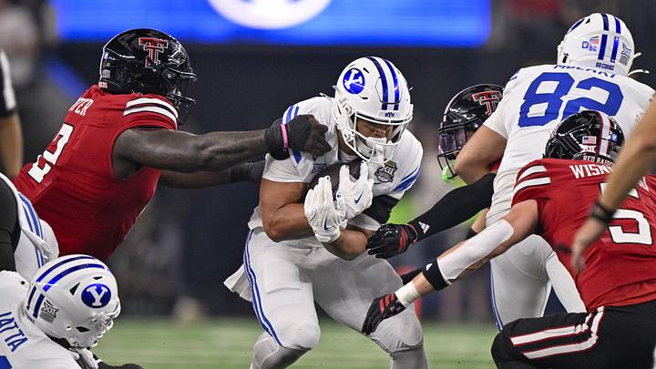 Dec 6, 2025; Arlington, TX, USA; Texas Tech Red Raiders defensive lineman Lee Hunter (2) tackles BYU Cougars running back LJ Martin (4) during the game between the Red Raiders and the Cougars at AT&T Stadium. Mandatory Credit: Jerome Miron-Imagn Images