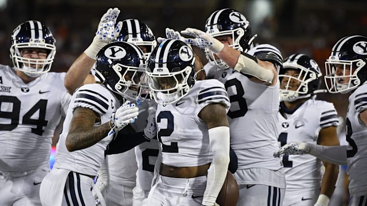 Sep 6, 2024; Dallas, Texas, USA; Brigham Young Cougars cornerback Marque Collins (2) celebrates with his teammates after he intercepts a pass during the second half against the Southern Methodist Mustangs at Gerald J. Ford Stadium.