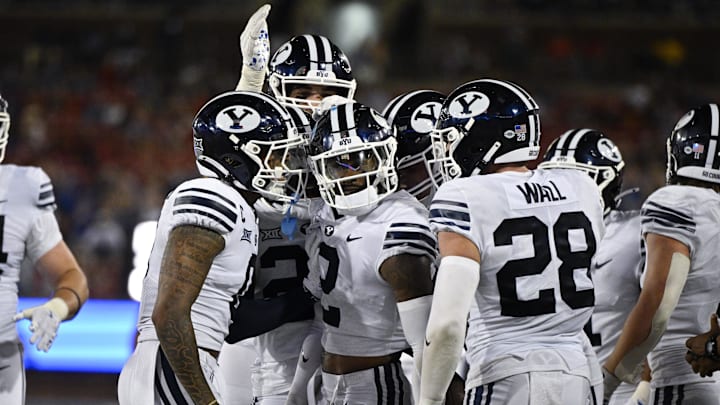 Sep 6, 2024; Dallas, Texas, USA; Brigham Young Cougars cornerback Marque Collins (2) celebrates with his teammates after he intercepts a pass during the second half against the Southern Methodist Mustangs at Gerald J. Ford Stadium. 