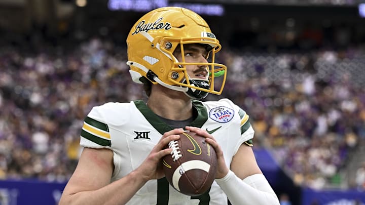 Dec 31, 2024; Houston, TX, USA; Baylor Bears quarterback Sawyer Robertson (13) warms up on the sideline during the first half against the LSU Tigers at NRG Stadium. Mandatory Credit: Maria Lysaker-Imagn Images Dec 31, 2024; Houston, TX, USA; Baylor Bears quarterback Sawyer Robertson (13) warms up on the sideline during the first half against the LSU Tigers at NRG Stadium. Mandatory Credit: Maria Lysaker-Imagn Images