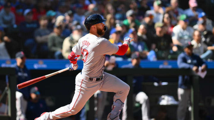 Mar 31, 2024; Seattle, Washington, USA; Boston Red Sox shortstop Trevor Story (10) hits a single against the Seattle Mariners during the seventh inning at T-Mobile Park. Mandatory Credit: Steven Bisig-USA TODAY Sports