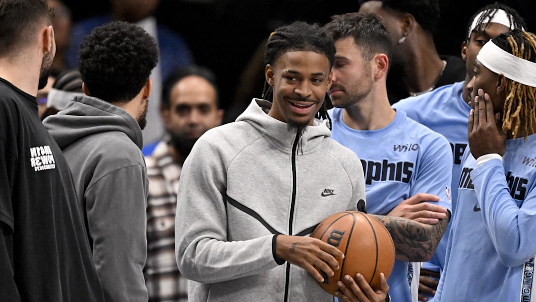 Nov 22, 2025; Dallas, Texas, USA; Memphis Grizzlies guard Ja Morant (12) looks on from the team bench during the second half against the Dallas Mavericks at the American Airlines Center. Mandatory Credit: Jerome Miron-Imagn Images