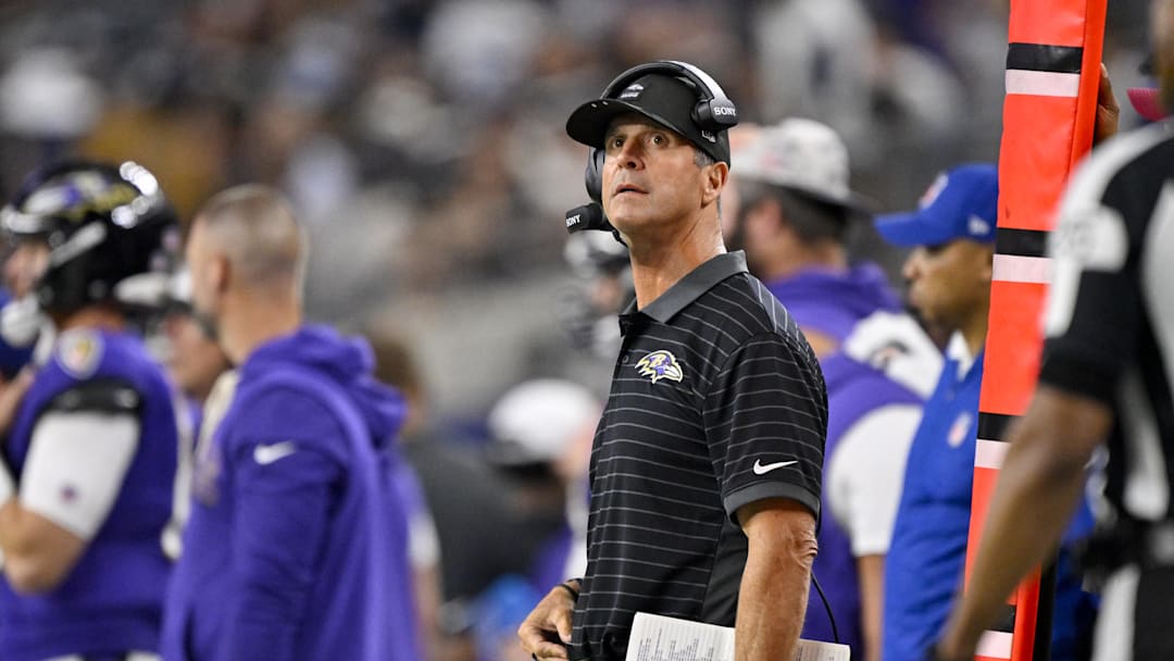 Aug 16, 2025; Arlington, Texas, USA; Baltimore Ravens head coach John Harbaugh looks on during the second half against the Dallas Cowboys at AT&T Stadium. Mandatory Credit: Jerome Miron-Imagn Images Aug 16, 2025; Arlington, Texas, USA; Baltimore Ravens head coach John Harbaugh looks on during the second half against the Dallas Cowboys at AT&T Stadium. Mandatory Credit: Jerome Miron-Imagn Images