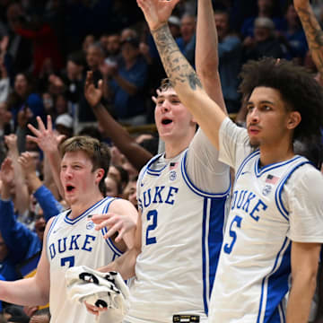 Mar 3, 2025; Durham, North Carolina, USA;  Duke Blue Devils forward Kon Knueppel (7) forward Cooper Flagg (2) guard Tyrese Proctor (5) and forward Isaiah Evans (3) react during the second half against the Wake Forest Demon Deacons at Cameron Indoor Stadium.  The Blue Devils won 93-60. Mandatory Credit: Rob Kinnan-Imagn Images