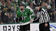 May 13, 2025; Dallas, Texas, USA; Dallas Stars left wing Jamie Benn (14) is led off the ice by linesman Trent Knorr (74) after receiving a roughing penalty against the Winnipeg Jets during the third period in game four of the second round of the 2025 Stanley Cup Playoffs at American Airlines Center. Mandatory Credit: Jerome Miron-Imagn Images