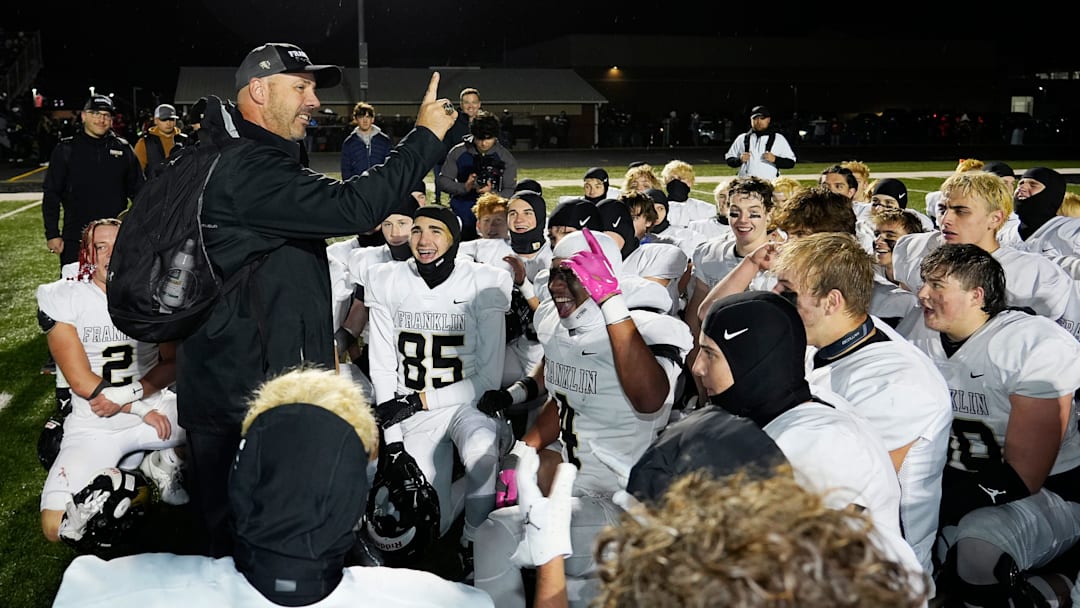 Franklin head football coach Louis Brown (standing) is one of 25 nominees for the 2025 Wisconsin High School Football Coach of the Year