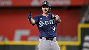 May 2, 2025; Arlington, Texas, USA; Seattle Mariners third baseman Ben Williamson (9) points to the dugout after he hits a double against the Texas Rangers during the fifth inning at Globe Life Field. Mandatory Credit: Jerome Miron-Imagn Images