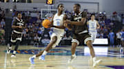 Nov 25, 2025; Fort Myers, Florida, USA; North Carolina Tar Heels forward Caleb Wilson (8) drives to the basket past St. Bonaventure Bonnies forward Daniel Egbuniwe (3) in the first half  at Suncoast Credit Union Arena. Mandatory Credit: Nathan Ray Seebeck-Imagn Images