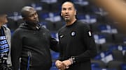 Oct 7, 2024; Dallas, Texas, USA; Dallas Mavericks general manager Nico Harrison (right) looks on during warms up before the game between the Dallas Mavericks and the Memphis Grizzlies at the American Airlines Center. Mandatory Credit: Jerome Miron-Imagn Images