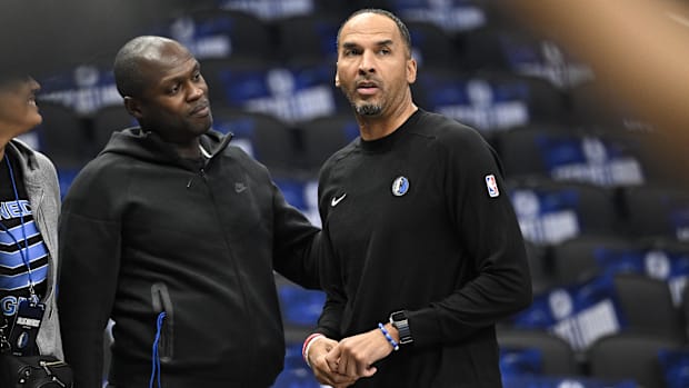 Dallas Mavericks general manager Nico Harrison looks on during warmups.