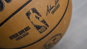 A view of an NBA basketball and the NBA logo before the game between the Dallas Mavericks and the Toronto Raptors at the American Airlines Center.