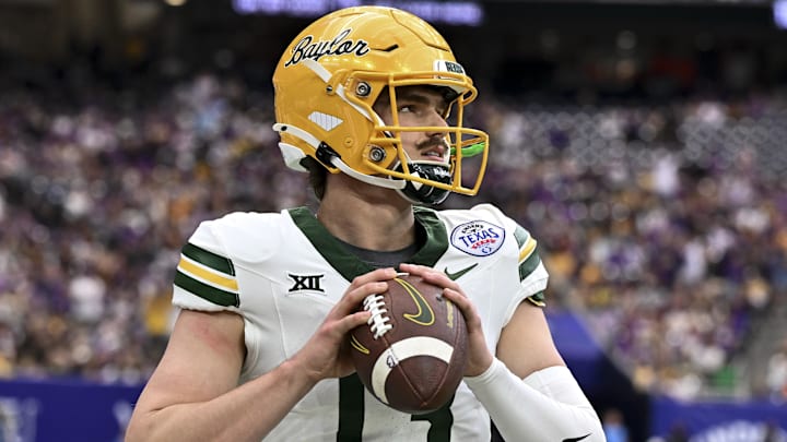 Dec 31, 2024; Houston, TX, USA; Baylor Bears quarterback Sawyer Robertson (13) warms up on the sideline during the first half against the LSU Tigers at NRG Stadium. Mandatory Credit: Maria Lysaker-Imagn Images 