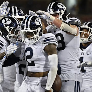 Sep 6, 2024; Dallas, Texas, USA; Brigham Young Cougars cornerback Marque Collins (2) celebrates with his teammates after he intercepts a pass during the second half against the Southern Methodist Mustangs at Gerald J. Ford Stadium. 