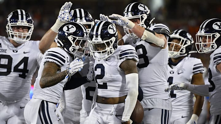 Sep 6, 2024; Dallas, Texas, USA; Brigham Young Cougars cornerback Marque Collins (2) celebrates with his teammates after he intercepts a pass during the second half against the Southern Methodist Mustangs at Gerald J. Ford Stadium. 