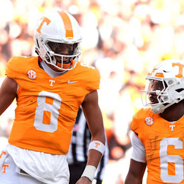 Nov 23, 2024; Knoxville, Tennessee, USA; Tennessee Volunteers quarterback Nico Iamaleava (8) talks with running back Dylan Sampson (6) during a game against the UTEP Miners. Mandatory Credit: Saul Young/USA TODAY Network via Imagn Images