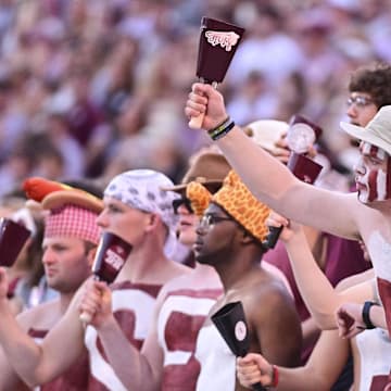 Mississippi State Bulldogs fans cheer during the first quarter of the game against the Toledo Rockets at Davis Wade Stadium at Scott Field.