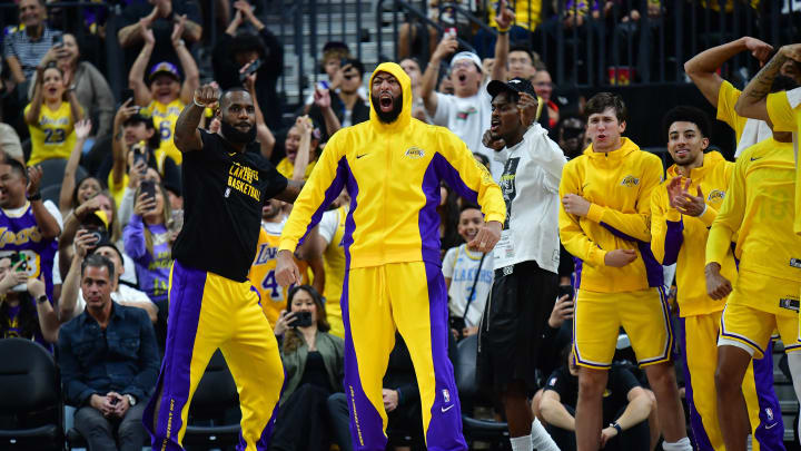 Oct 9, 2023; Las Vegas, Nevada, USA; Los Angeles Lakers forward LeBron James (23) forward Anthony Davis (3) guard Austin Reaves (15) react watching game action against the Brooklyn Nets during the second half at T-Mobile Arena. Mandatory Credit: Gary A. Vasquez-USA TODAY Sports