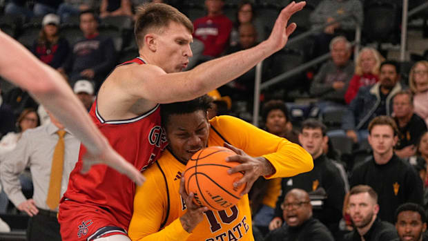 St. Mary's Paulius Murauskas shuts down the drive of Arizona State's BJ Freeman.