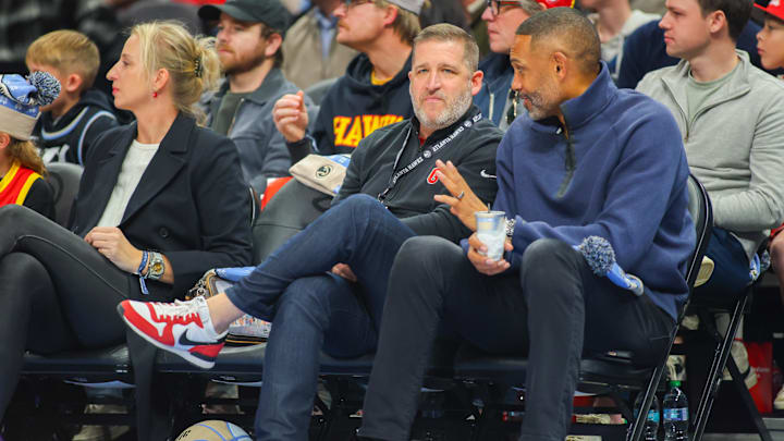 Dec 23, 2024; Atlanta, Georgia, USA; Georgia Bulldogs athletic director Josh Brooks sits with former NBA player Grant Hill during a game between the Atlanta Hawks and Minnesota Timberwolves in the first quarter at State Farm Arena. Dec 23, 2024; Atlanta, Georgia, USA; Georgia Bulldogs athletic director Josh Brooks sits with former NBA player Grant Hill during a game between the Atlanta Hawks and Minnesota Timberwolves in the first quarter at State Farm Arena.