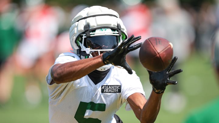 Jul 27, 2024; Florham Park, NJ, USA; New York Jets wide receiver Garrett Wilson (5) catches the ball during a drill during training camp at Atlantic Health Jets Training Center. 