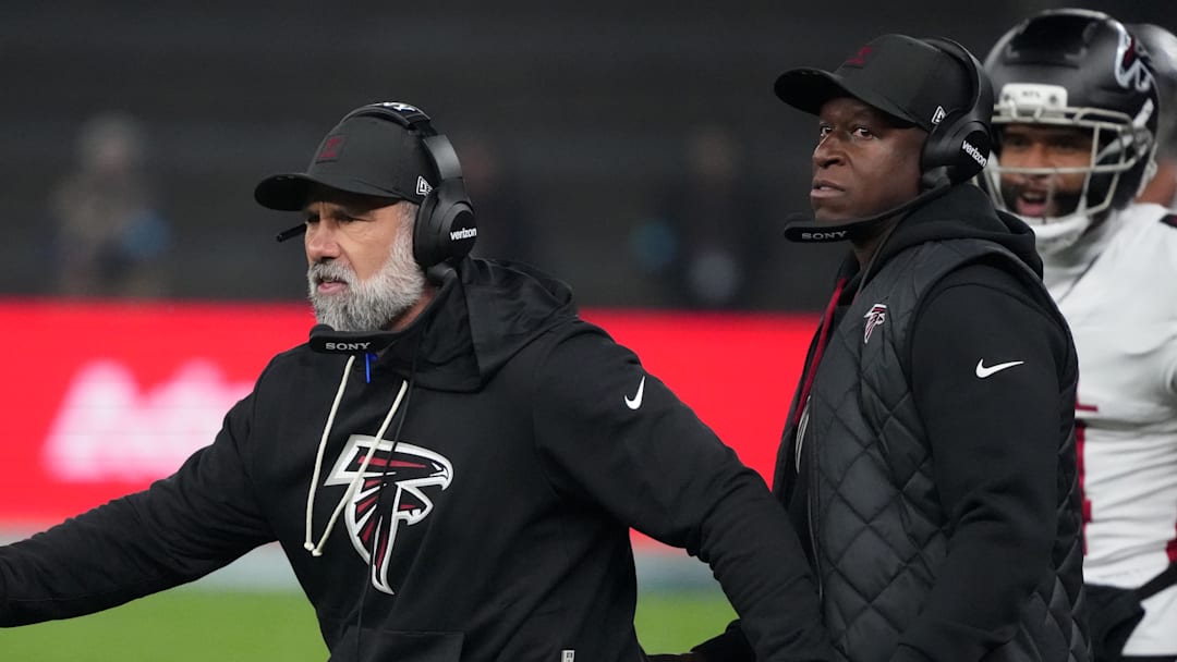 Nov 9, 2025; Berlin, Germany; Atlanta Falcons defensive coordinator Jeff Ulbrich (left) and head coach Raheem Morris in the second half against the Atlanta Falcons during the NFL Berlin Game at Olympic Stadium. Mandatory Credit: Kirby Lee-Imagn Images