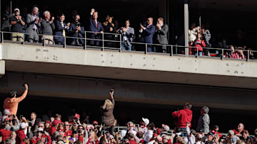 Nov 9, 2019; Tuscaloosa, AL, USA; President Donald Trump and his wife Melania Trump wave to fans in attendance for the Alabama Crimson Tide game against the LSU Tigers during the first quarter at Bryant-Denny Stadium. Mandatory Credit: John David Mercer-Imagn Images