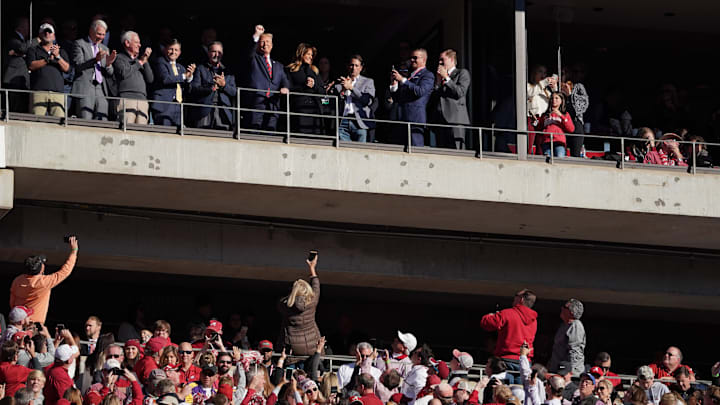 Nov 9, 2019; Tuscaloosa, AL, USA; President Donald Trump and his wife Melania Trump wave to fans in attendance for the Alabama Crimson Tide game against the LSU Tigers during the first quarter at Bryant-Denny Stadium. Mandatory Credit: John David Mercer-Imagn Images