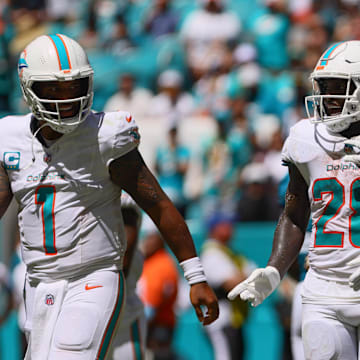 Sep 8, 2024; Miami Gardens, Florida, USA; Miami Dolphins running back De'Von Achane (28) celebrates with teammates after scoring a touchdown against the Jacksonville Jaguars during the second quarter at Hard Rock Stadium.