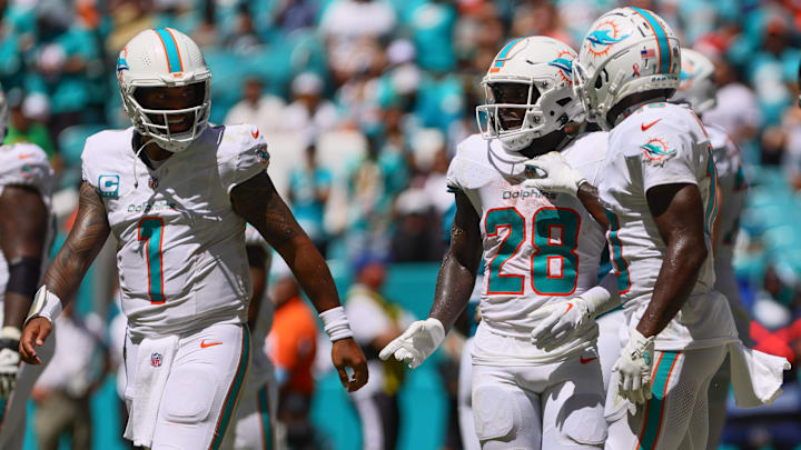 Miami Dolphins running back De'Von Achane (28) celebrates with teammates after scoring a touchdown against the Jacksonville Jaguars during the second quarter at Hard Rock Stadium. 