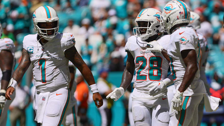 Miami Dolphins running back De'Von Achane (28) celebrates with teammates after scoring a touchdown against the Jacksonville Jaguars during the second quarter at Hard Rock Stadium. 