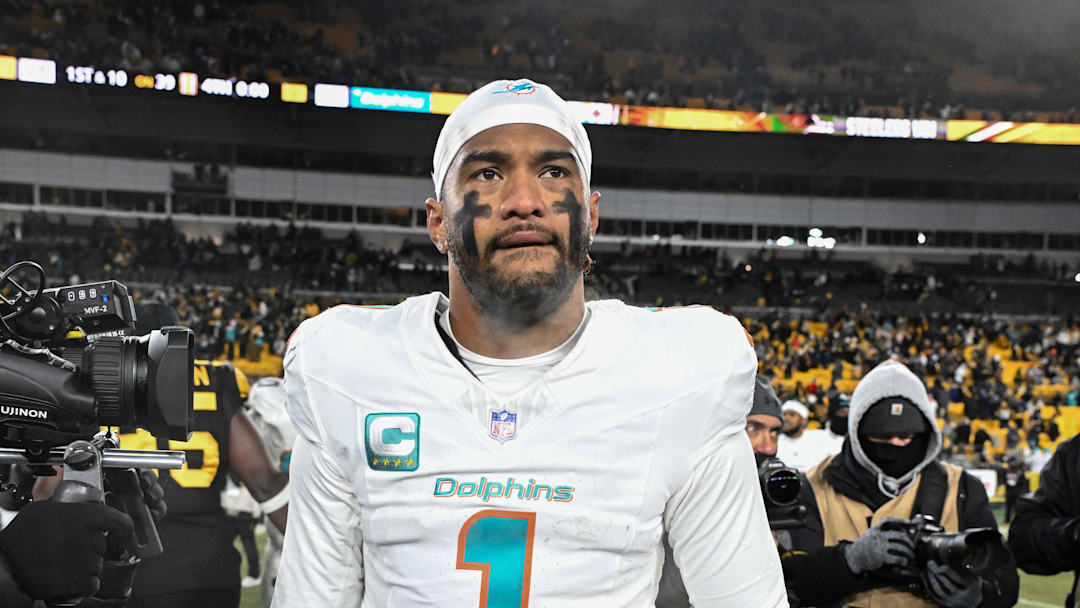 Dec 15, 2025; Pittsburgh, Pennsylvania, USA; Miami Dolphins quarterback Tua Tagovailoa (1) leaves the  field following a game against the Pittsburgh Steelers at Acrisure Stadium. Mandatory Credit: Barry Reeger-Imagn Images