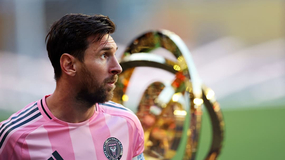 Lionel Messi, Inter Miami CF captain, walks by the FIFA Club World Cup trophy Saturday before the Herons' scoreless draw against Egyptian champions Al Ahly FC.