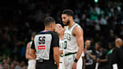 Apr 11, 2025; Boston, Massachusetts, USA; Boston Celtics forward Jayson Tatum (0) talks to referee John Conley (56) during the first half against the Charlotte Hornets at TD Garden. Mandatory Credit: Eric Canha-Imagn Images