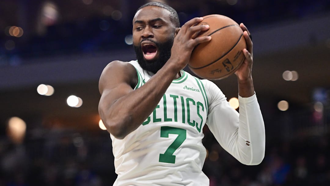 Dec 11, 2025; Milwaukee, Wisconsin, USA; Boston Celtics forward Jaylen Brown (7) grabs a rebound in the first quarter against the Milwaukee Bucks at Fiserv Forum.