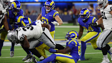 Aug 19, 2023; Inglewood, California, USA;  Los Angeles Rams linebacker DeAndre Square (58) tackles Las Vegas Raiders running back Austin Walter (32) during the third quarter at SoFi Stadium. Mandatory Credit: Kiyoshi Mio-Imagn Images