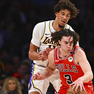 Mar 22, 2025; Los Angeles, California, USA; Chicago Bulls guard Josh Giddey (3) moves the ball against Los Angeles Lakers center Jaxson Hayes (11) and forward LeBron James (23) during the first half at Crypto.com Arena. Mandatory Credit: Jonathan Hui-Imagn Images