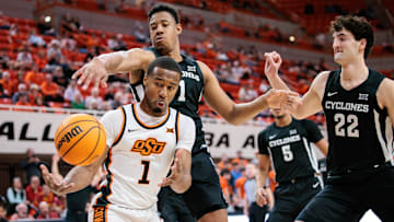 Feb 25, 2025; Stillwater, Oklahoma, USA; Oklahoma State Cowboys guard Bryce Thompson (1) goes after a rebound during the first half against the Iowa State Cyclones at Gallagher-Iba Arena. Mandatory Credit: William Purnell-Imagn Images