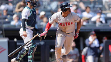 Sep 14, 2024; Bronx, New York, USA; Boston Red Sox third baseman Rafael Devers (11) follows through on a two run single against the New York Yankees during the fifth inning at Yankee Stadium. Mandatory Credit: Brad Penner-Imagn Images