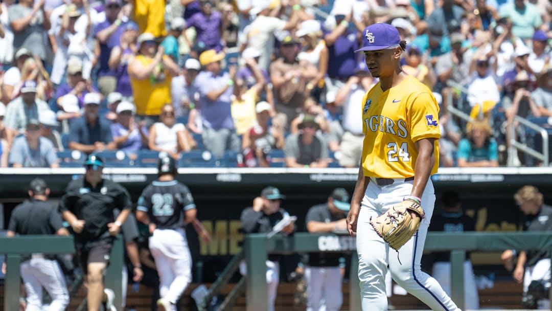 Jun 22, 2025; Omaha, Neb, USA;  LSU Tigers starting pitcher Anthony Eyanson (24) walks off the mound after the first inning during the game against the Coastal Carolina Chanticleers at Charles Schwab Field. Mandatory Credit: Steven Branscombe-Imagn Images