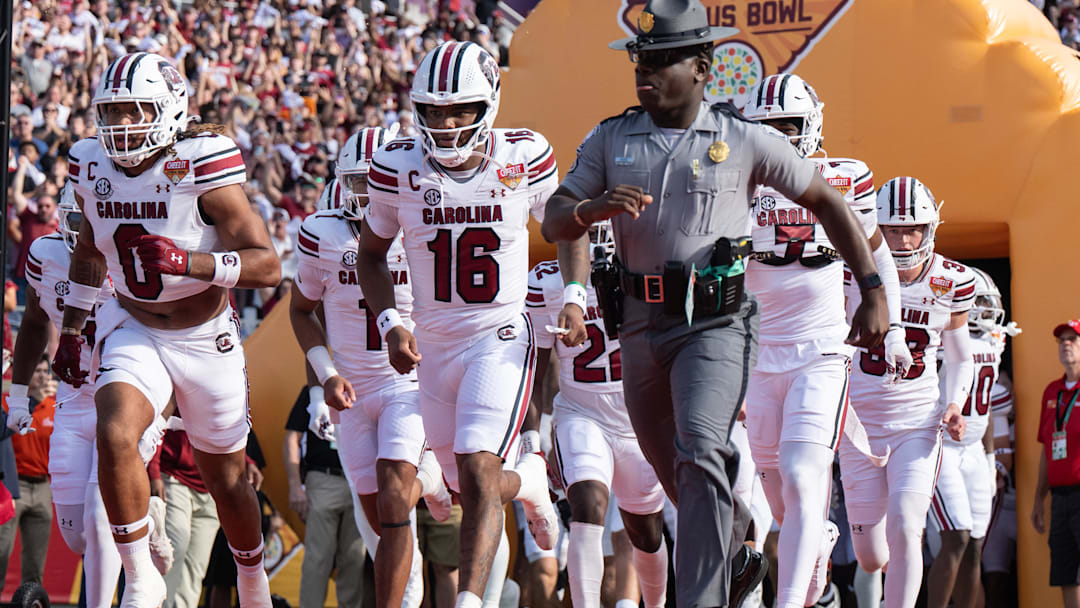 Dec 31, 2024; Orlando, FL, USA; South Carolina Gamecocks quarterback LaNorris Sellers (16) leads his team agains the Illinois Fighting Illini before the game at Camping World Stadium. Mandatory Credit: Jeremy Reper-Imagn Images