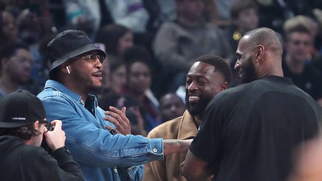 Feb 19, 2023; Salt Lake City, UT, USA; Carmelo Anthony, Dwyane Wade and LeBron James greet each other before the 2023 NBA All-Star Game at Vivint Arena. Mandatory Credit: Kyle Terada-Imagn Images
