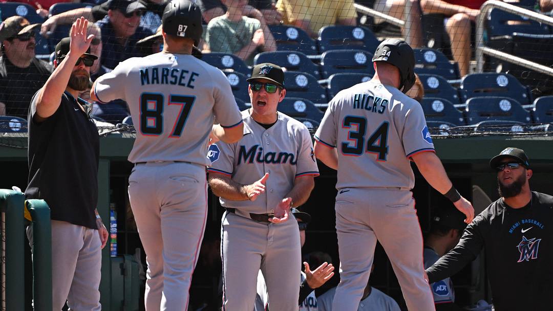 Miami Marlins manager Clayton McCullough reacts after they scored